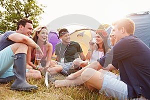 Friends having fun on the campsite at a music festival