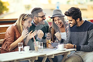 Friends having fun a coffee together after shopping