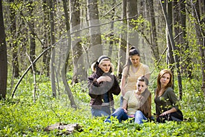 Friends having fun in the forest