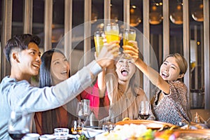 Friends having fun in hot pot restaurant