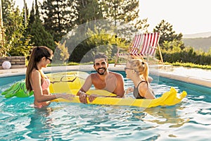 Friends having fun in the swimming pool