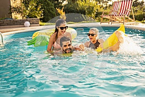 Friends having fun in the swimming pool