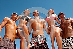 Friends having a laugh on the beach