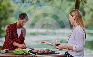 friends having picnic french dinner party outdoor during summer holiday