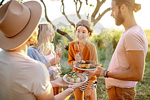 Friends having a picnic in the garden