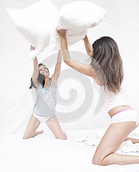 Friends having a pillow fight