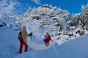 Friends hiking snowshoeing in Mount Seymour Provincial Park in winter.