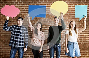 Friends holding up copyspace placard thought bubbles