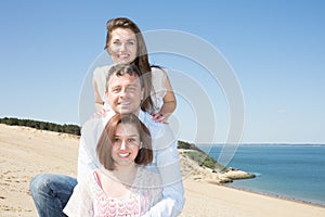 Friends holidays man and two girl in summer beach vacation
