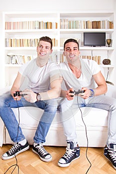 Friends at home playing video game