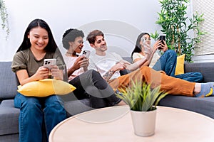 Friends Interacting with Phones in Modern Living Room photo