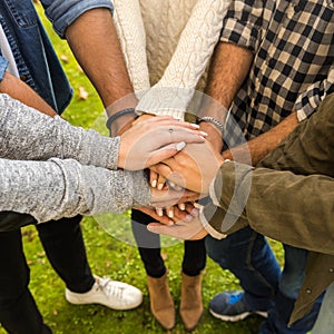 Friends joining hands