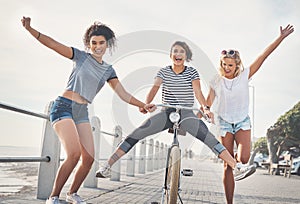 Friends keep you living on the wild side. three friends having fun on the promenade.