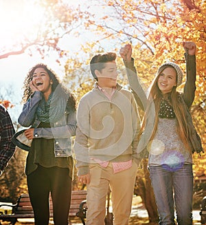 Friends let you live out your weirdness. a group of teenage friends enjoying an autumn day outside together.