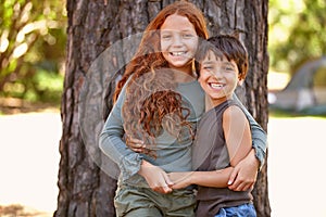 Friends for life. A little boy and girl embracing outside iwhile on camp.
