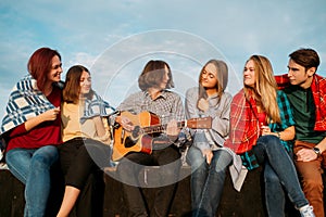 Friends listen busker musician play art leisure