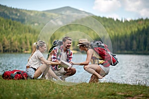 Friends looking at a travel map.adventure on mountain