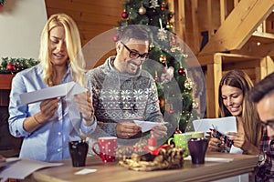 Friends making Christmas decorations