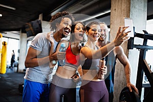 Friends making selfie in the gym after workout