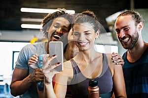 Friends making selfie in the gym after workout