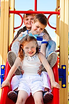 Friends on the playground slide