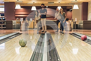 Friends playing bowling