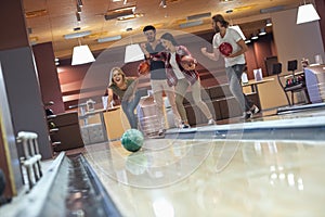 Friends playing bowling