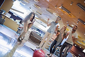 Friends playing bowling