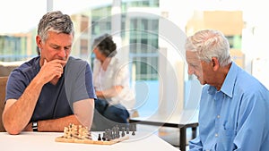 Friends playing chess