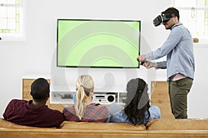 Friends Playing Computer Game With Virtual Reality Headset