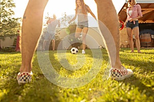 Friends playing football in the backyard