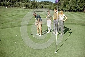 Friends playing golf