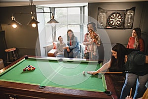 Friends Playing Pool