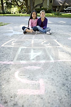 Friends playing together on driveway