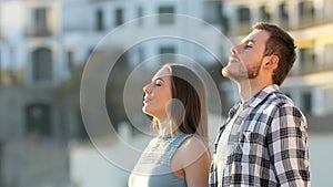 Friends relaxing breathing fresh air in a town