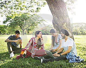 Friends Relaxing Sitting Park Gadgets Concept