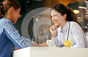 Friends in restaurant talking coffee fun