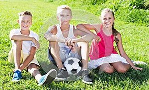 Friends resting after game with ball