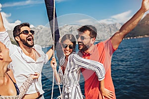 Friends sailing on yacht. Vacation, travel, sea, friendship and people concept
