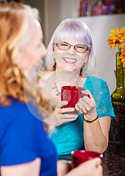 Friends Share a Laugh drinking coffee