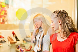 Friends shoe shopping in a mall