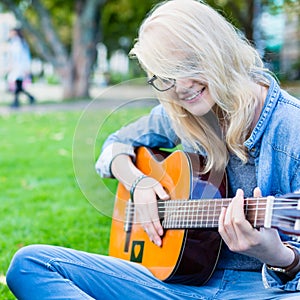 Friends singing songs in park having fun