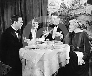 Friends sitting together at a dinner table