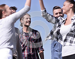 Friends students giving each other a high five.