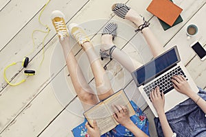 Friends study laptop and book