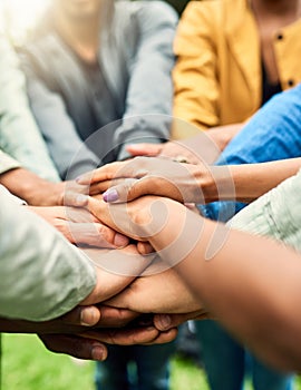 Friends, support and stack of hands of people for motivation, community and friendship outdoors. Teamwork, diversity and