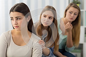 Friends supporting worried girl