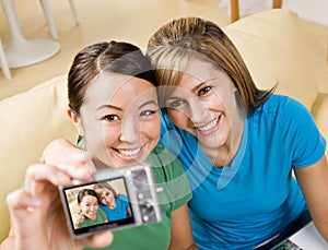 Friends taking self-portrait with digital camera