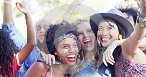 Friends taking selfie with mobile phone at music festival 4k