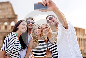 Friends taking selfie with smartphone